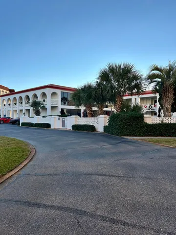 a view of kitchen and living room with a sink