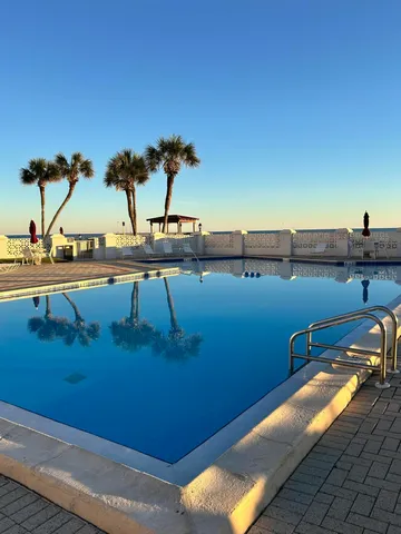 a view of a balcony with chairs