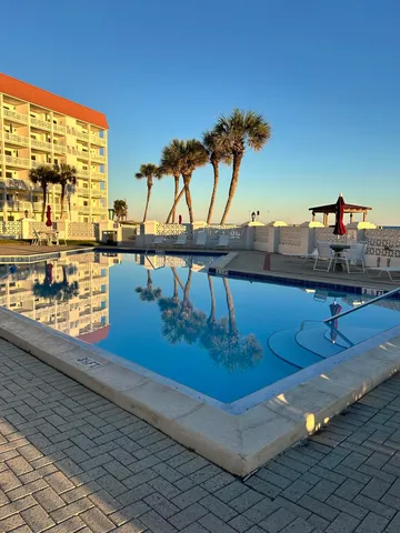 a view of swimming pool from a balcony