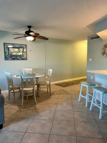 a kitchen with stainless steel appliances granite countertop a sink refrigerator and cabinets