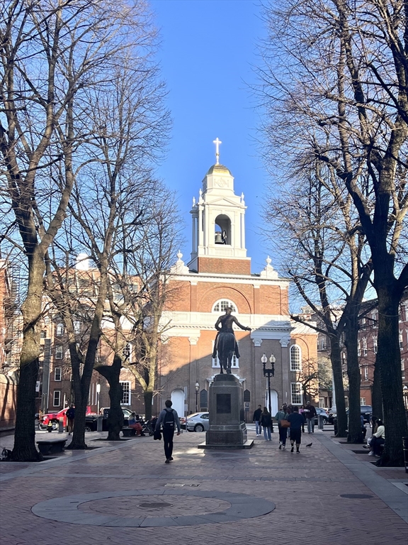 26 Unity Street, Unit 5 Boston, MA 02113 - Photo 13 of 15 a front view of a building with trees and cars
