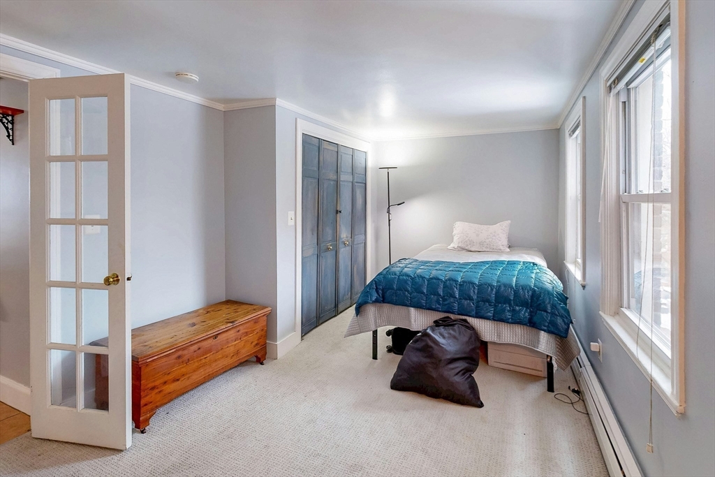 26 Unity Street, Unit 5 Boston, MA 02113 - Photo 7 of 15 a bedroom with a bed and a window