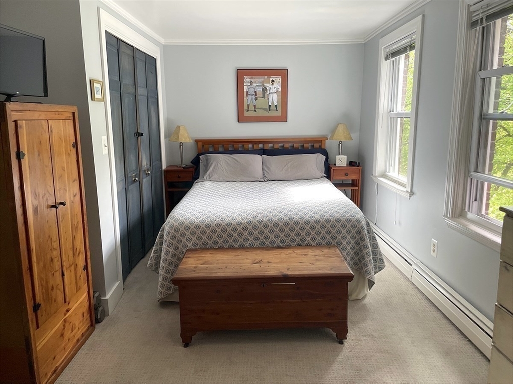 26 Unity Street, Unit 5 Boston, MA 02113 - Photo 8 of 15 a bedroom with a bed and a window