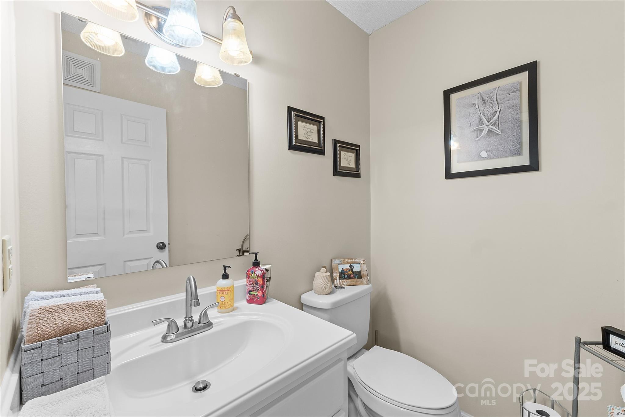 1553 16th Avenue Northeast, Unit 7 Hickory, NC 28601 - Photo 12 of 32 a bathroom with a sink vanity mirror and toilet