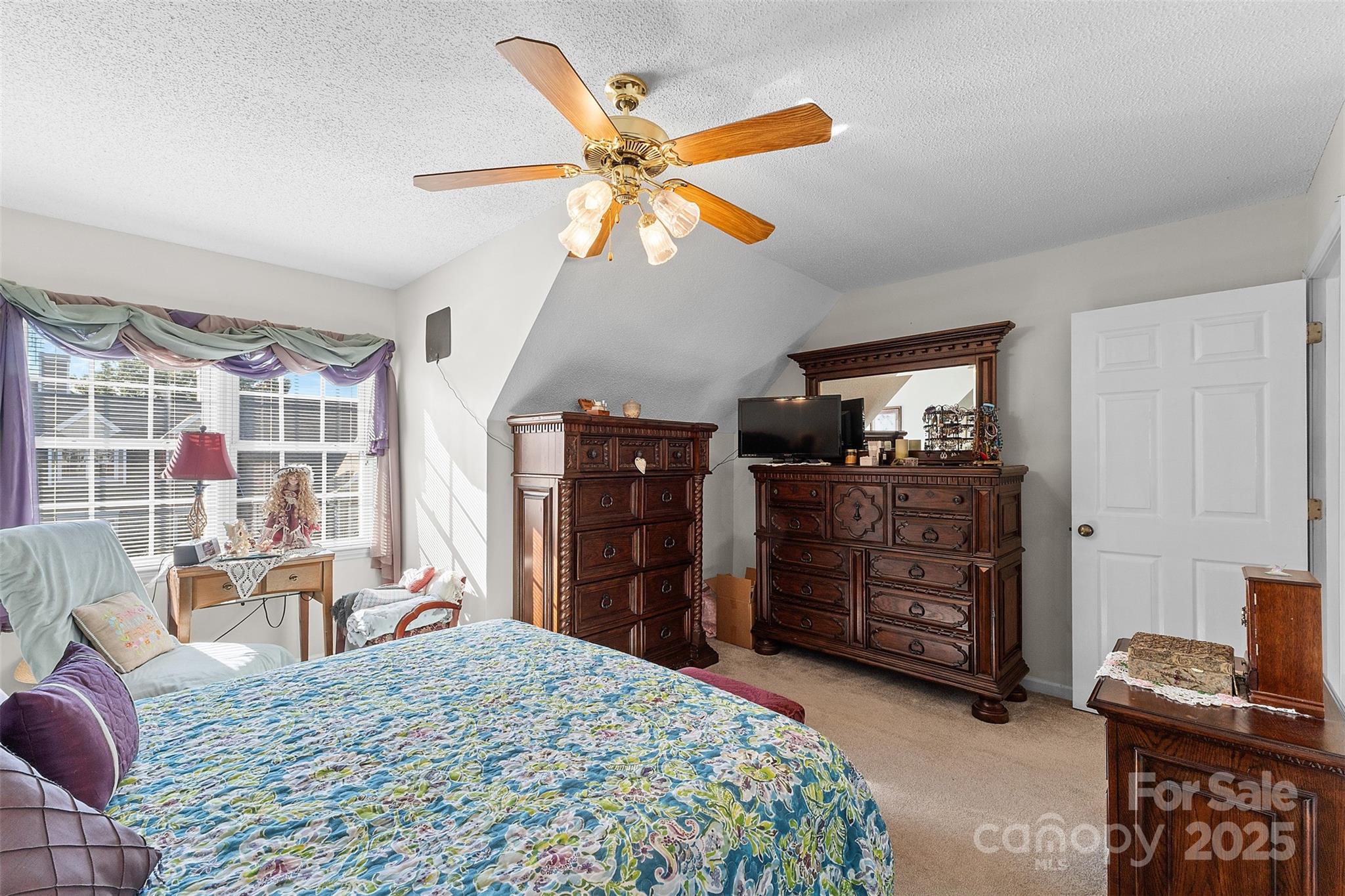 1553 16th Avenue Northeast, Unit 7 Hickory, NC 28601 - Photo 17 of 32 a bed room with a bed and a television