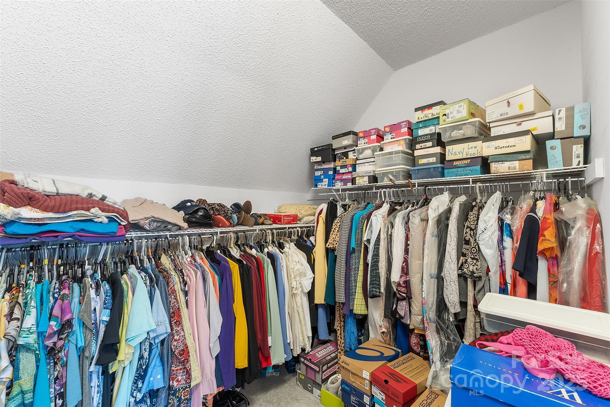 1553 16th Avenue Northeast, Unit 7 Hickory, NC 28601 - Photo 18 of 32 a view of walk in closet with clothes and shoes