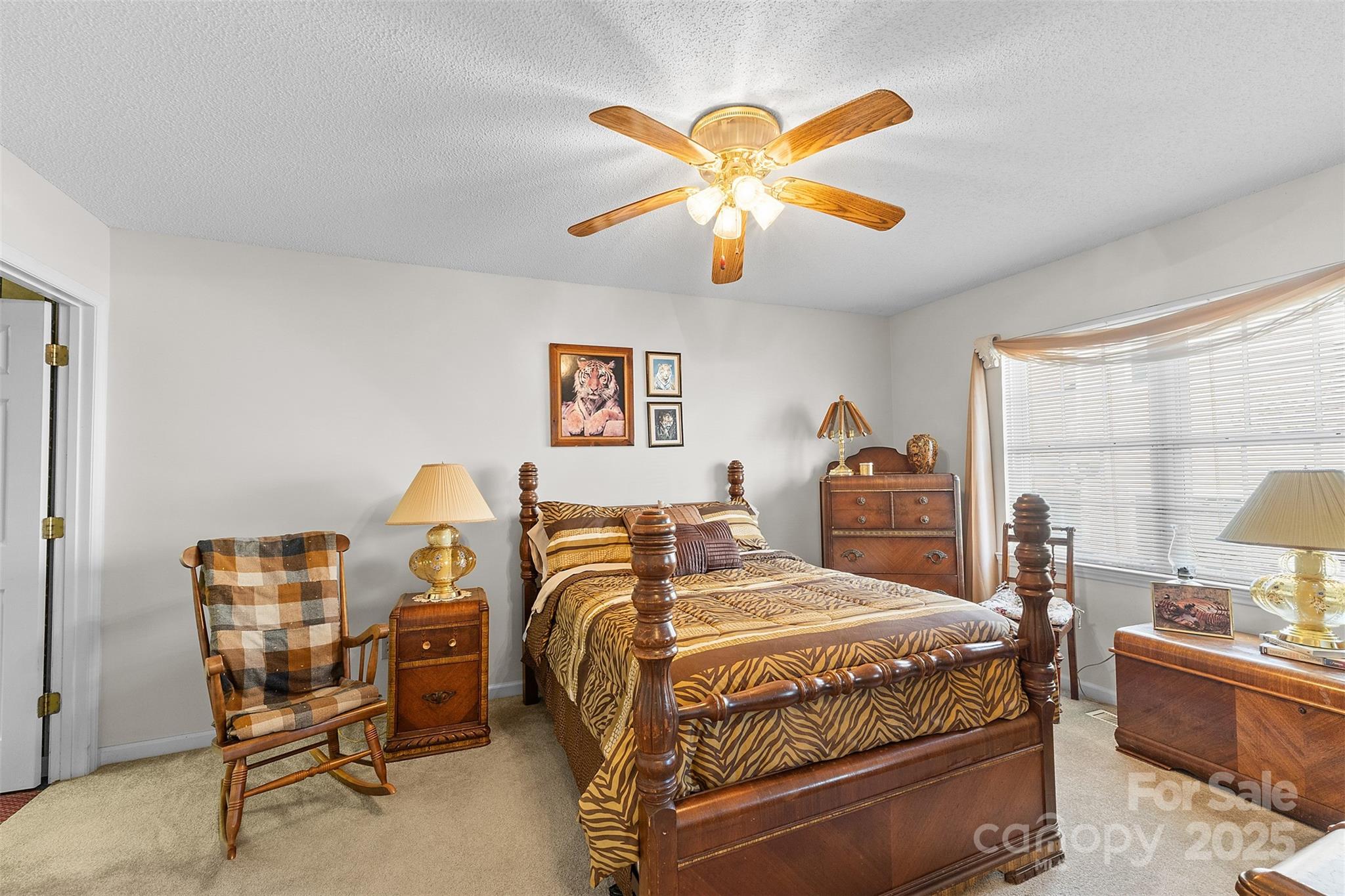 1553 16th Avenue Northeast, Unit 7 Hickory, NC 28601 - Photo 19 of 32 a bedroom with a bed and a chandelier