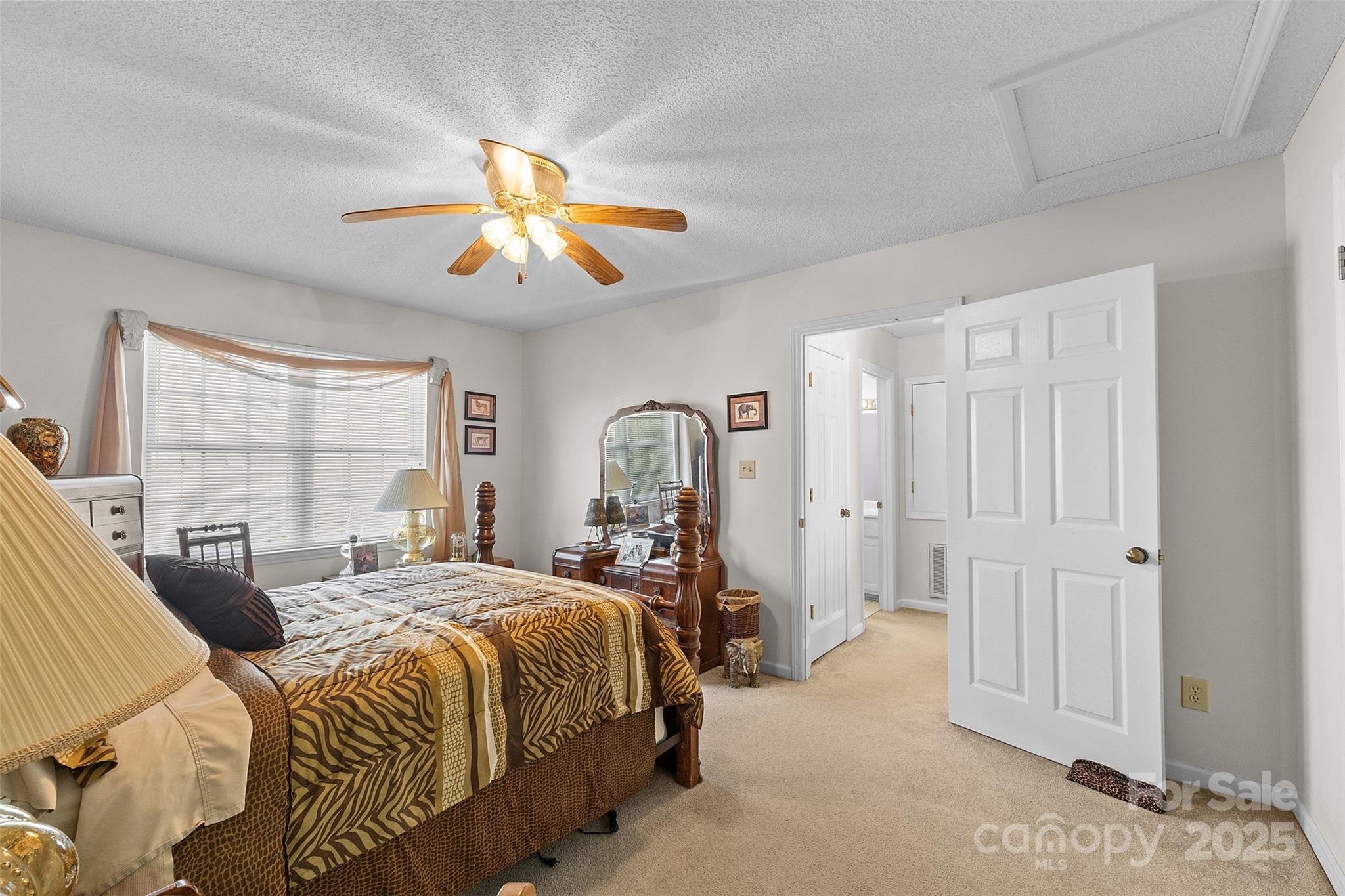 1553 16th Avenue Northeast, Unit 7 Hickory, NC 28601 - Photo 20 of 32 a bedroom with a bed and a chandelier
