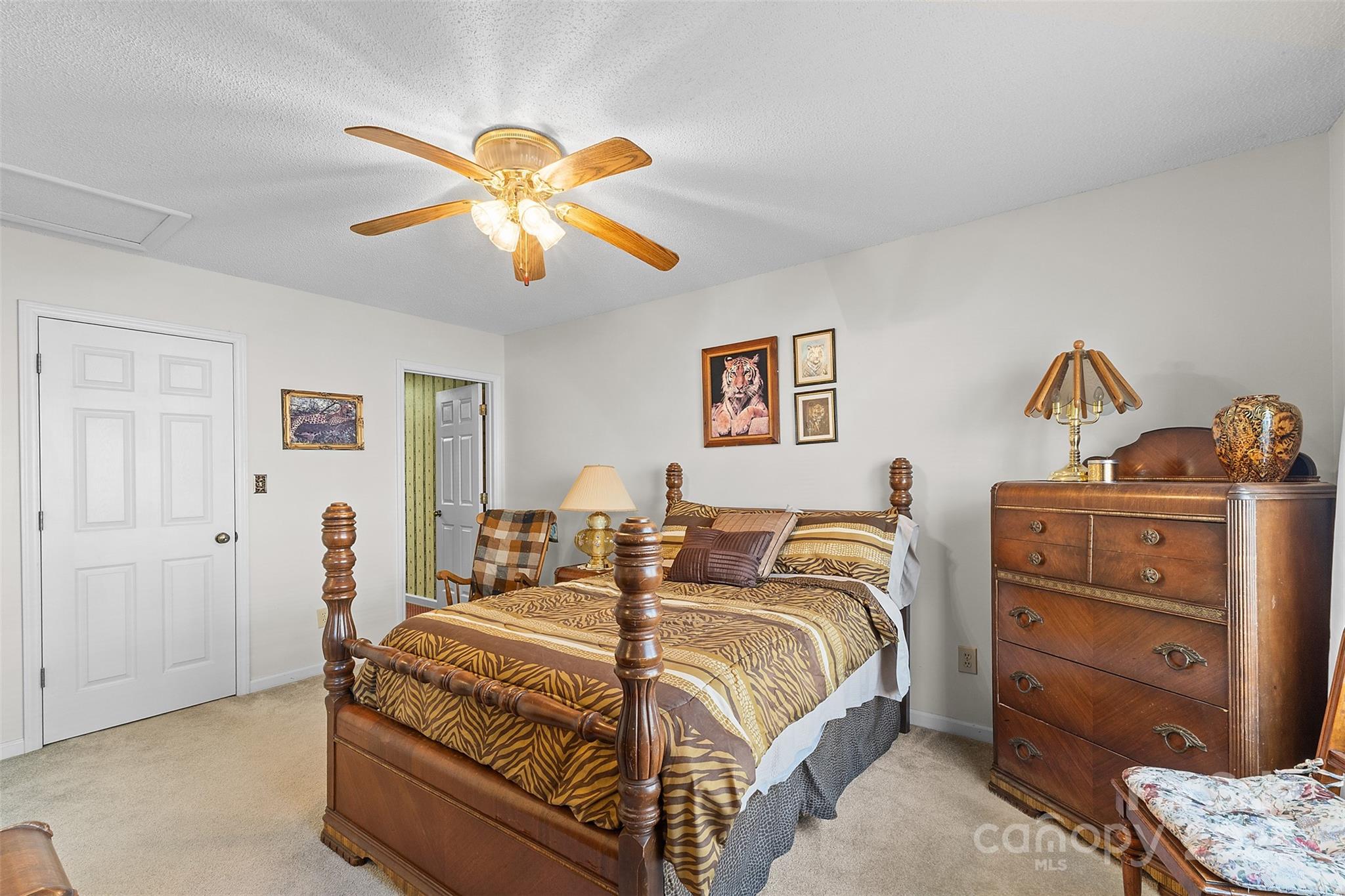 1553 16th Avenue Northeast, Unit 7 Hickory, NC 28601 - Photo 21 of 32 a bedroom with a bed and a chandelier