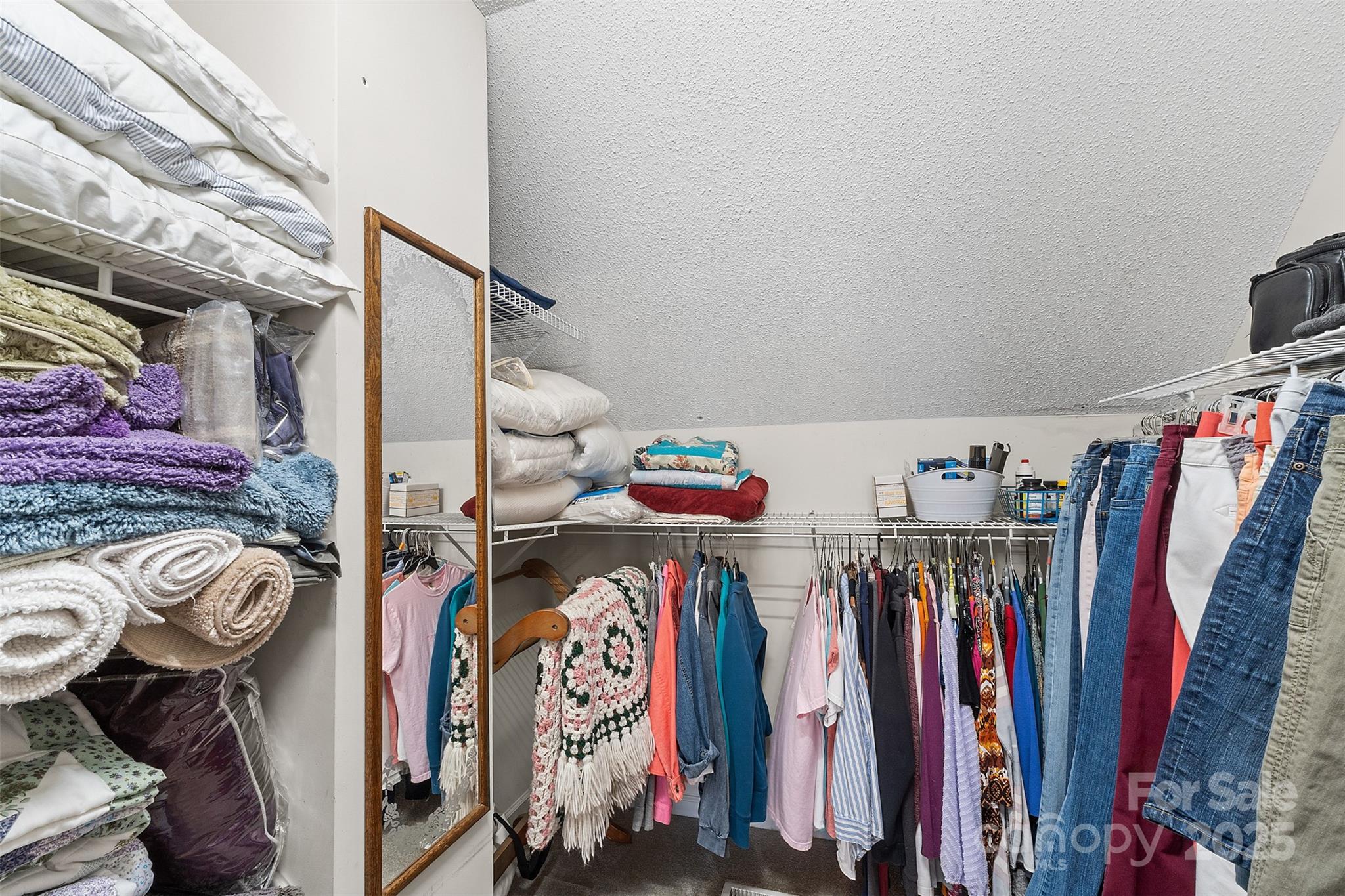 1553 16th Avenue Northeast, Unit 7 Hickory, NC 28601 - Photo 22 of 32 a view of walk in closet with clothes