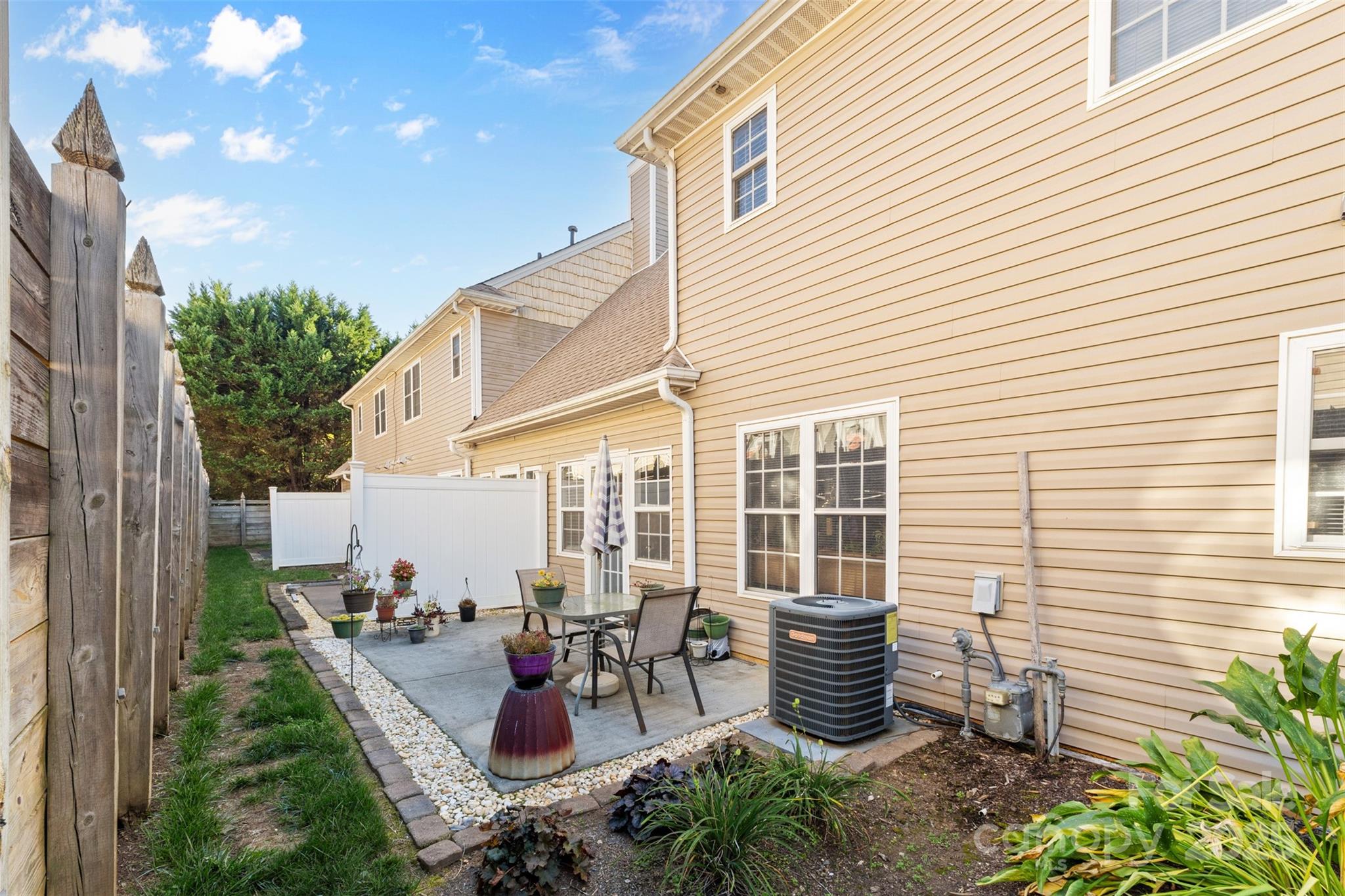 1553 16th Avenue Northeast, Unit 7 Hickory, NC 28601 - Photo 26 of 32 a view of a patio with chairs and plants