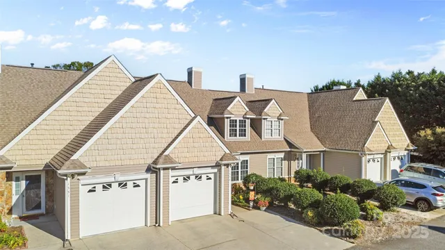 a view of house with yard