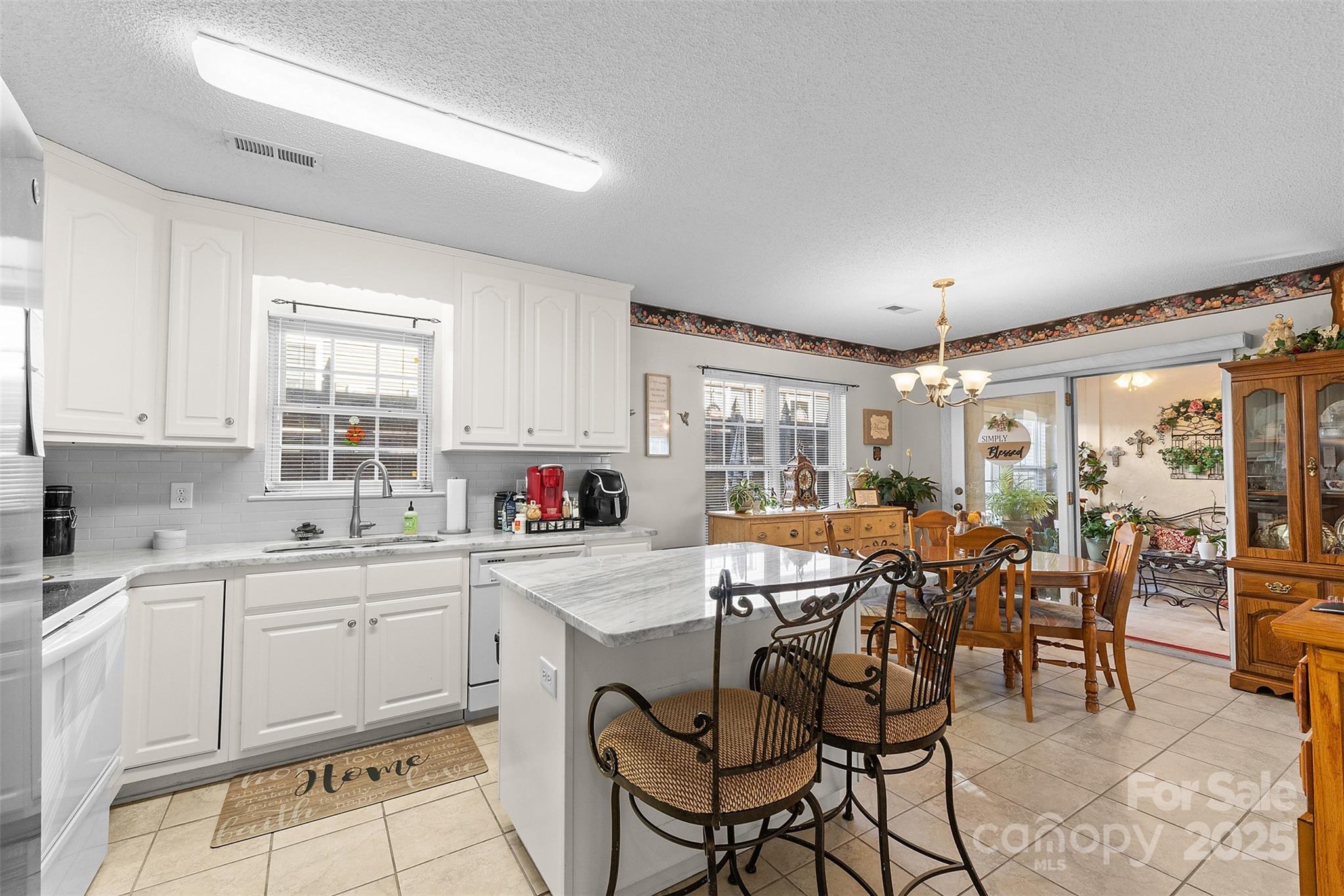 1553 16th Avenue Northeast, Unit 7 Hickory, NC 28601 - Photo 10 of 32 a large kitchen with a table and chairs