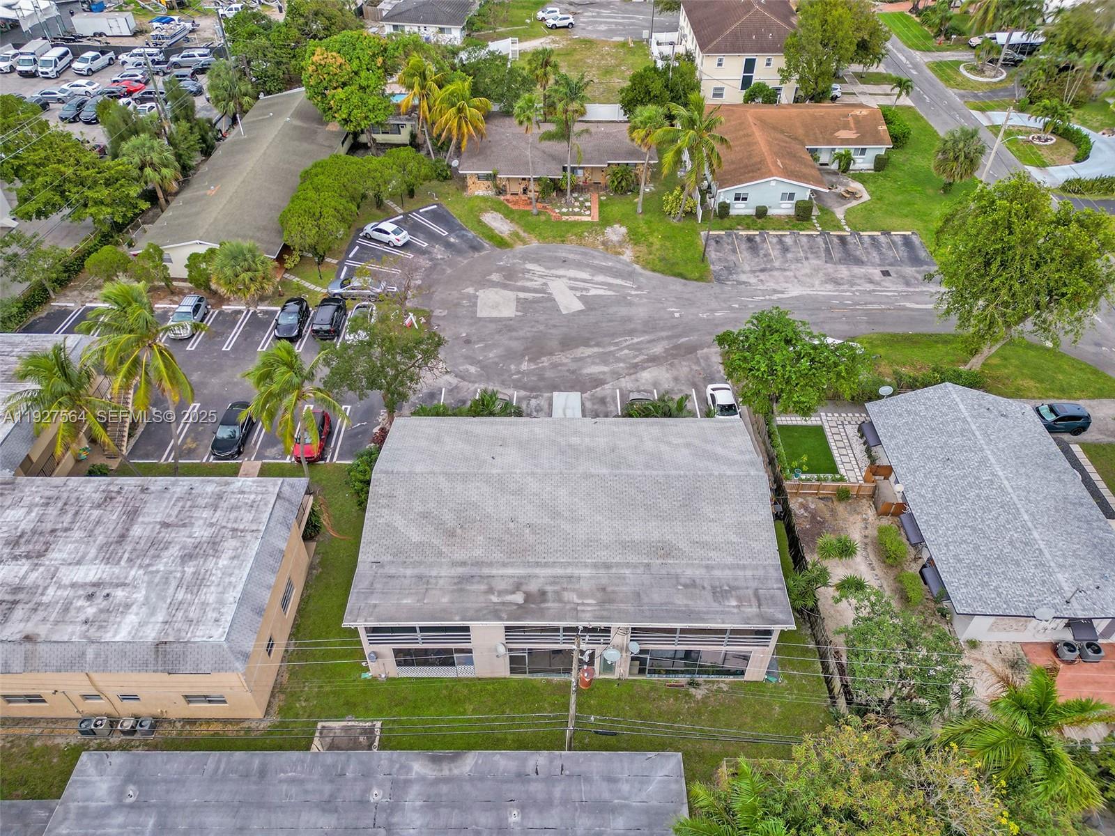 1211 Northeast 23rd Avenue, Unit 5 Pompano Beach, FL 33062 - Photo 6 of 10 an aerial view of a house with a yard
