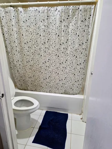 a bathroom with a toilet and a sink