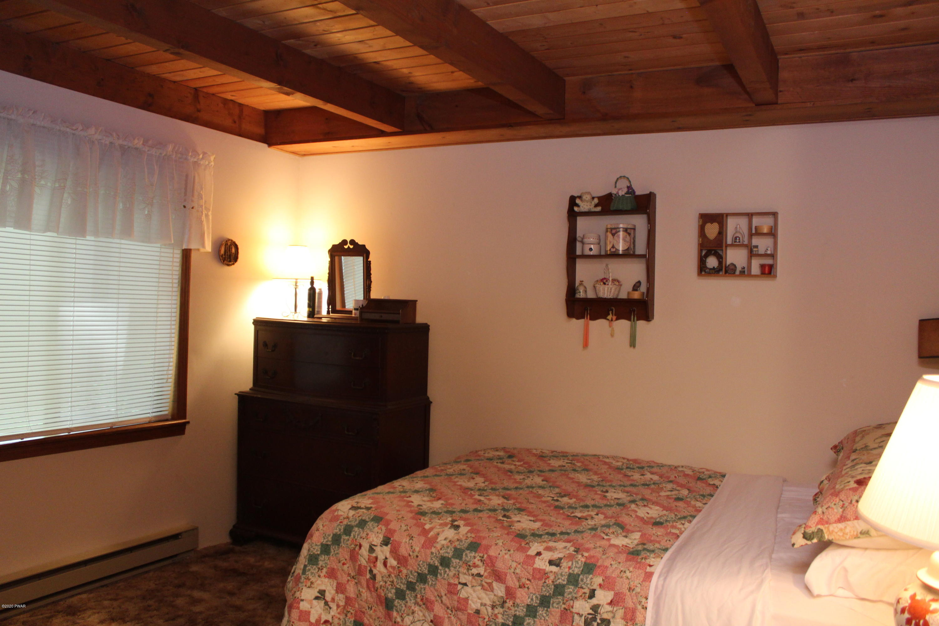 382 Northgate Road Lake Ariel, PA 18436 - Photo 7 of 20 a bedroom with a bed and a dresser