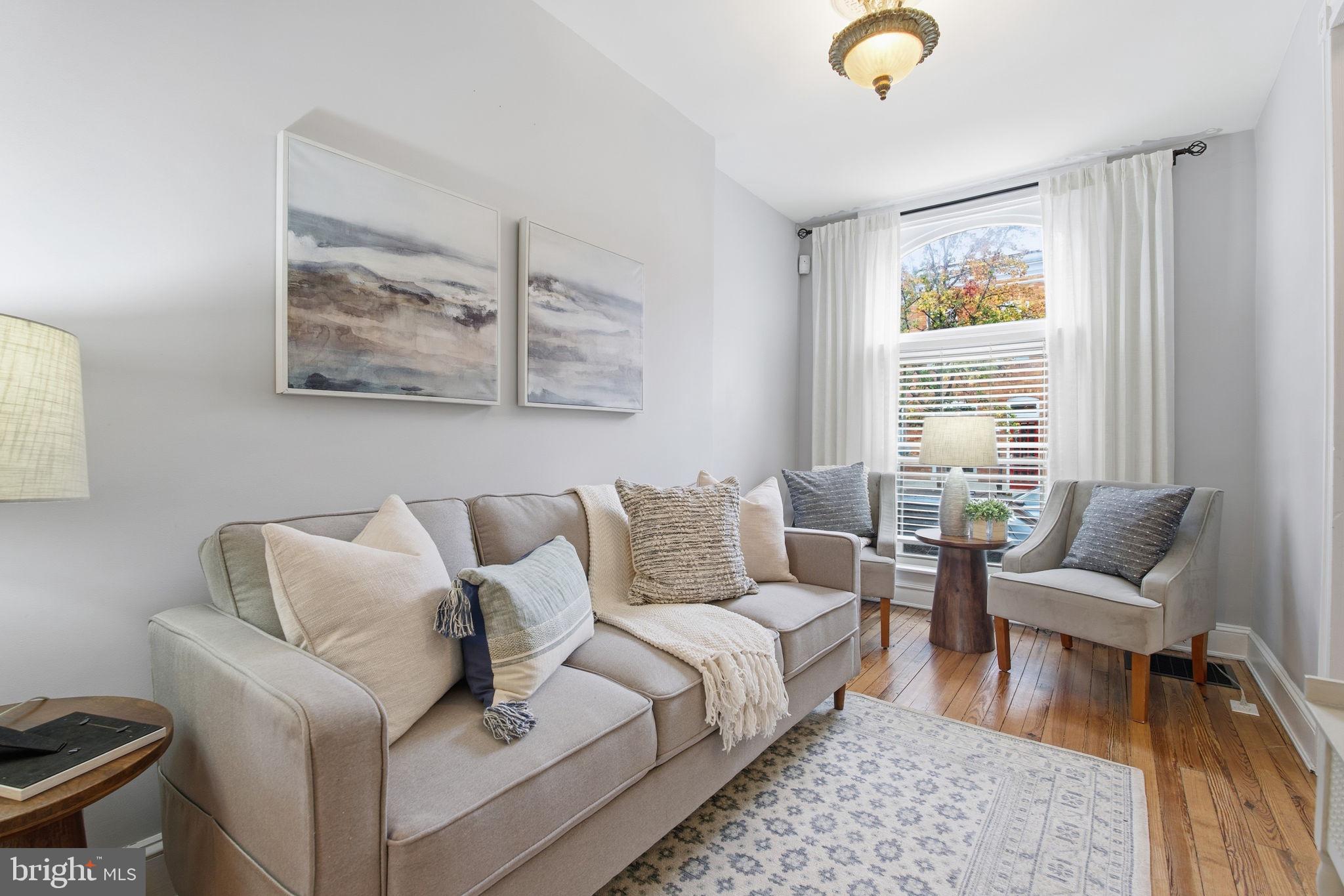 a living room with furniture and a rug