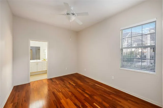 a bathroom with a tub a potted plant and a sink