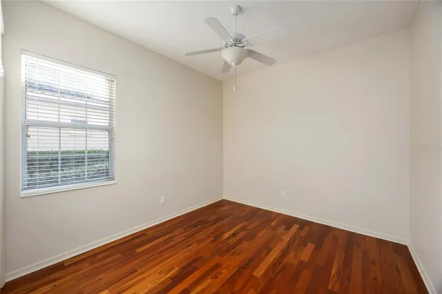 an aerial view of multiple houses with a yard