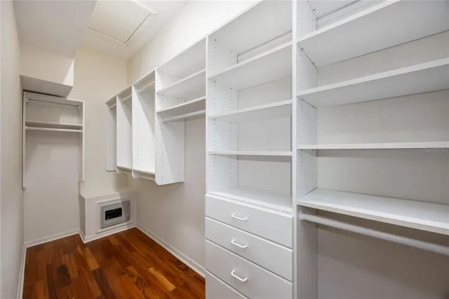 a room with gym equipment and floor to ceiling window