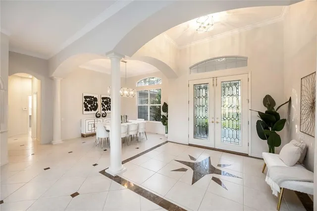 a room with patio furniture and a fireplace