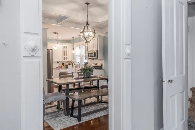 a view of a dining room with furniture and window