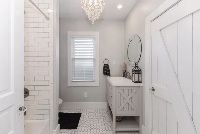 a view of room with window and front door