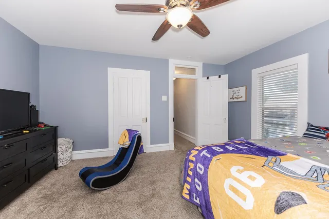 a bedroom with bed and gym equipment