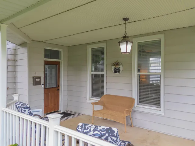 a front view of a house with outdoor seating