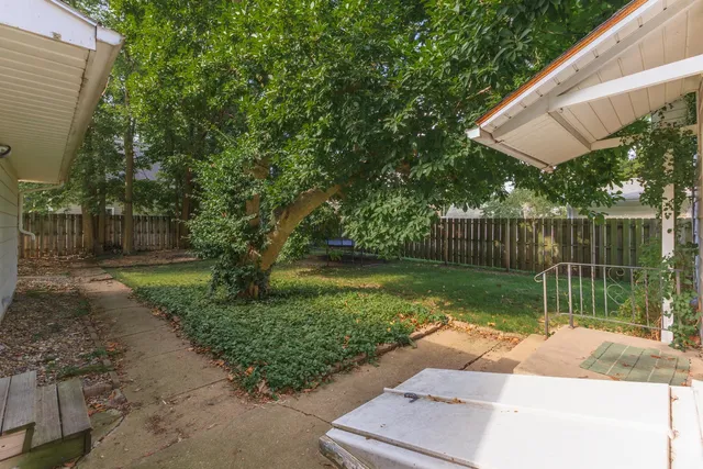 a view of a garden with a small pool