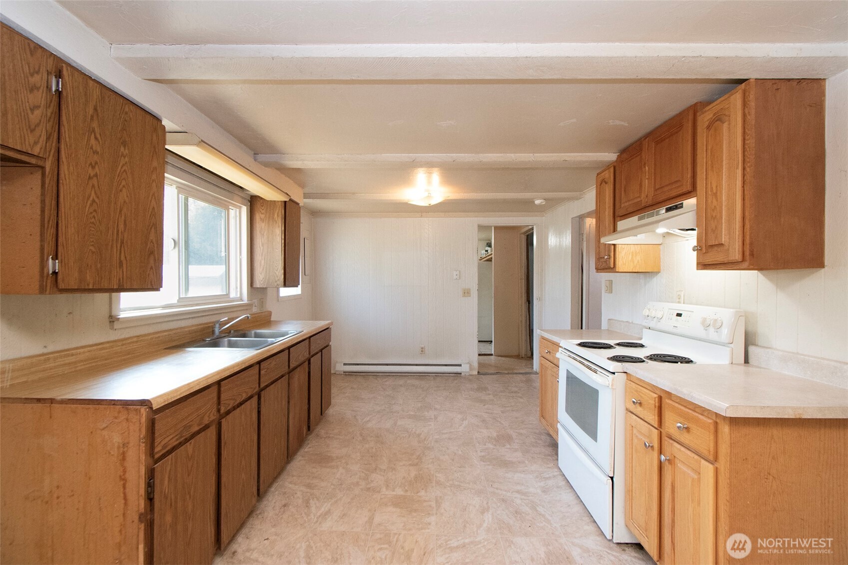 190 Pierson Road Sequim, WA 98382 - Photo 11 of 40 a kitchen with stainless steel appliances granite countertop a sink stove and refrigerator