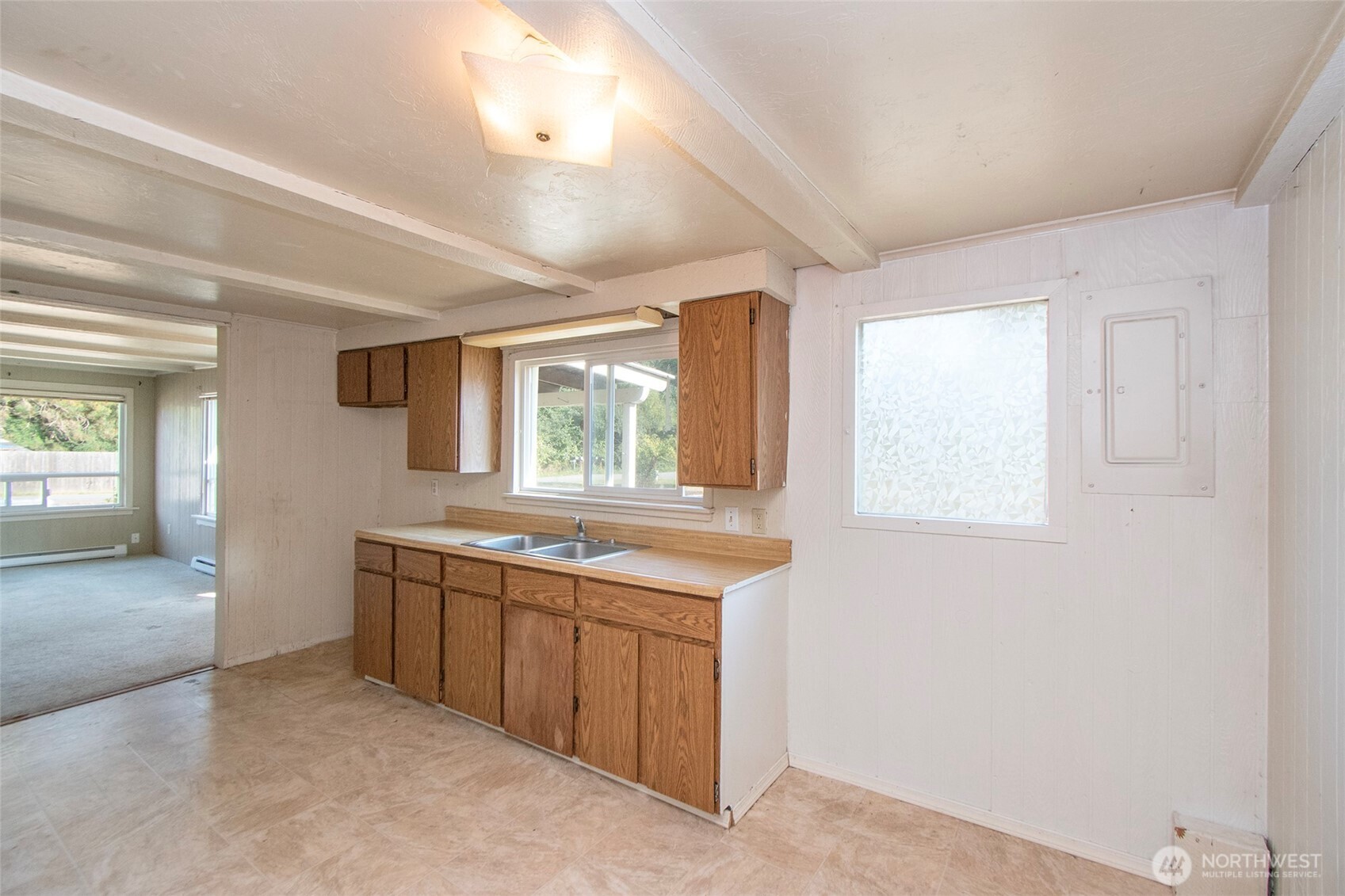 190 Pierson Road Sequim, WA 98382 - Photo 13 of 40 a kitchen with a sink stove and cabinets