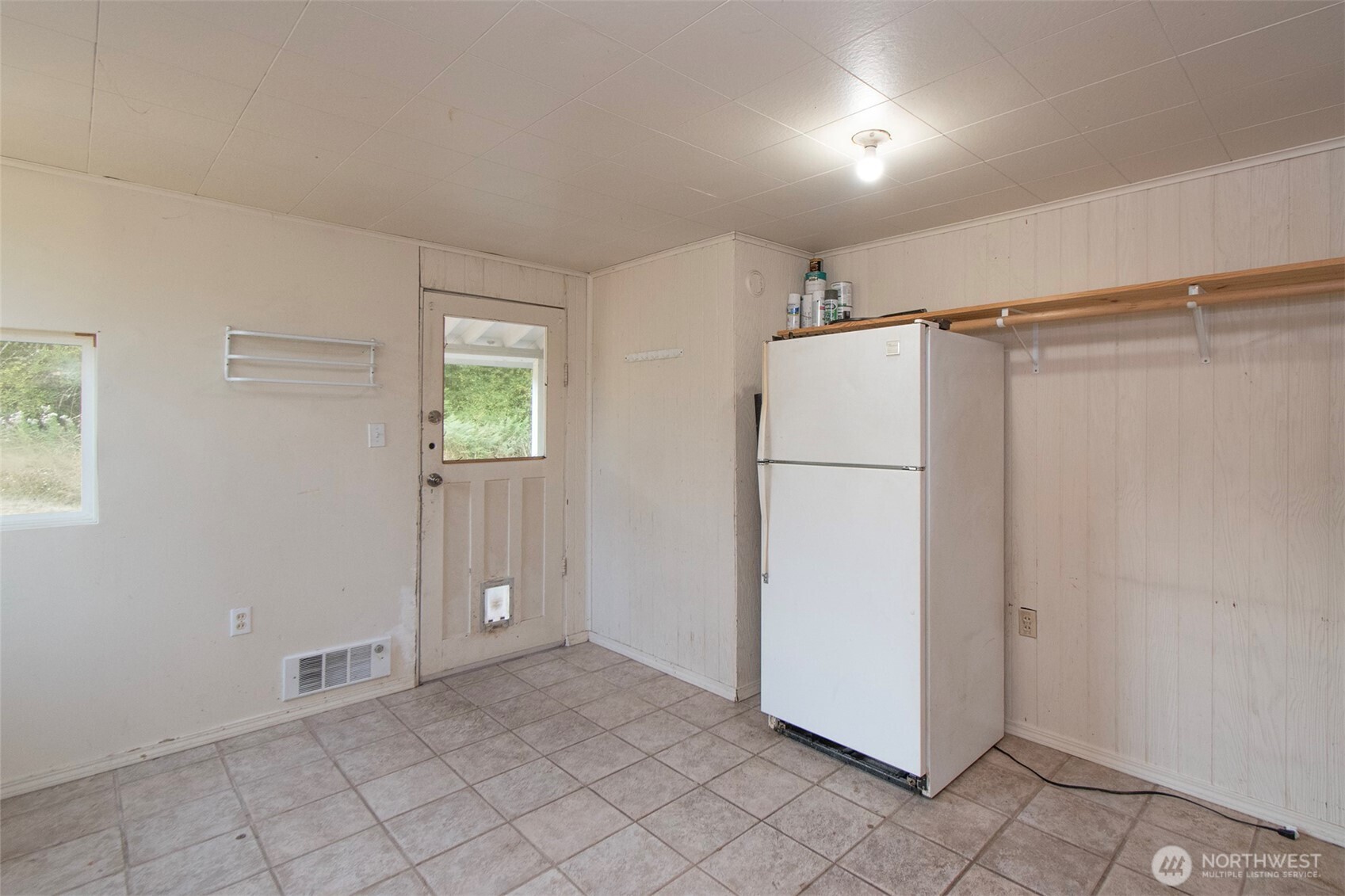 190 Pierson Road Sequim, WA 98382 - Photo 26 of 40 a view of a refrigerator in kitchen and furniture