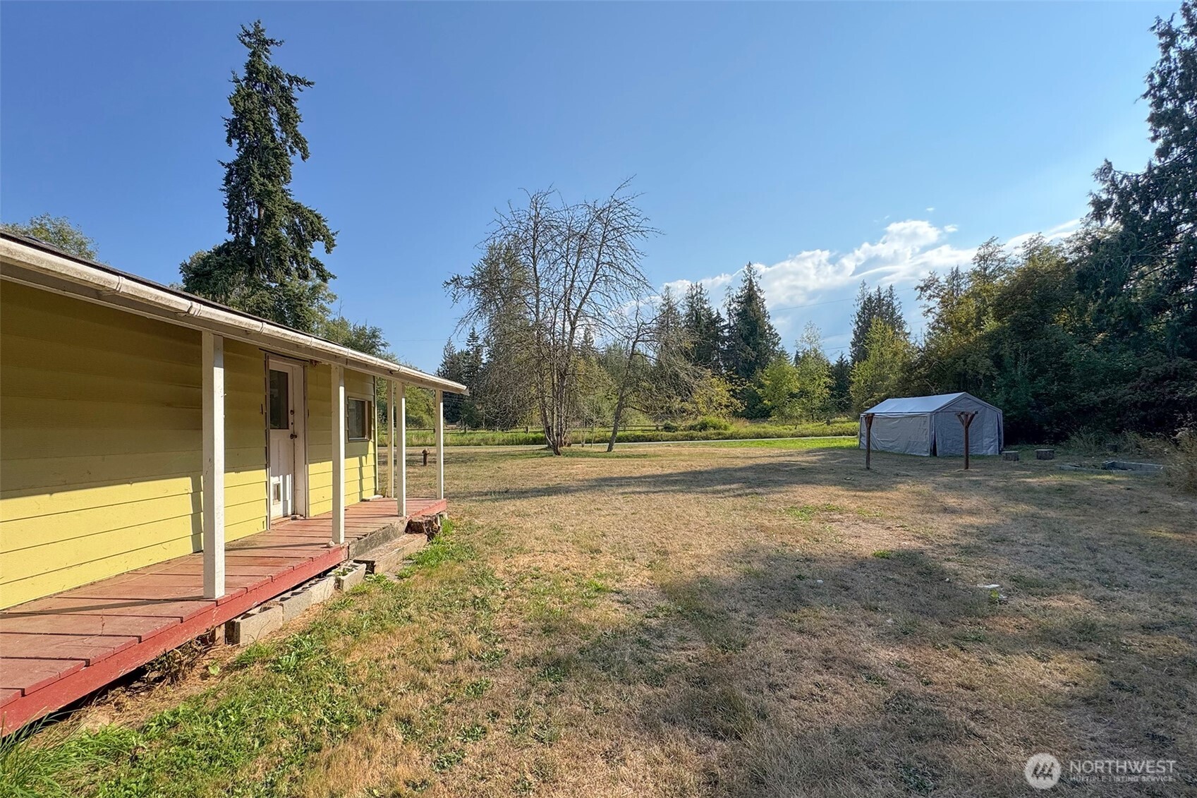 190 Pierson Road Sequim, WA 98382 - Photo 28 of 40 a view of a house with backyard and trees
