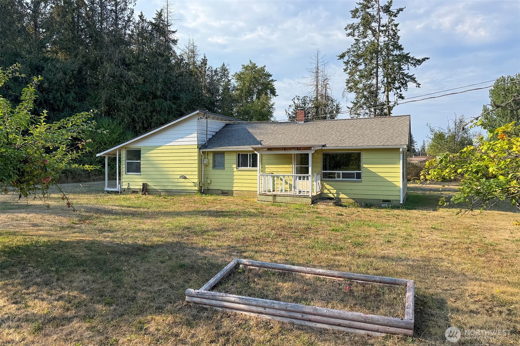 190 Pierson Road Sequim, WA 98382 - Photo 37 of 40 a view of a house with backyard and trees in the background
