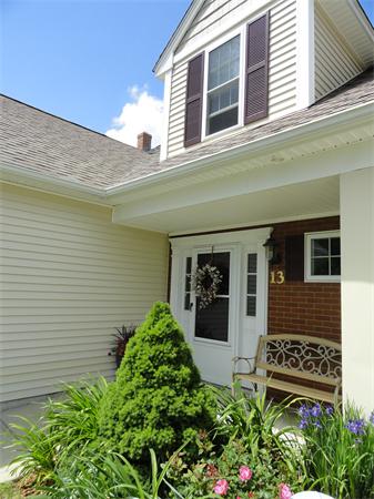 13 Billy Lane, Unit 13 Rutland, MA 01543 - Photo 3 of 25 a front view of a house with a yard