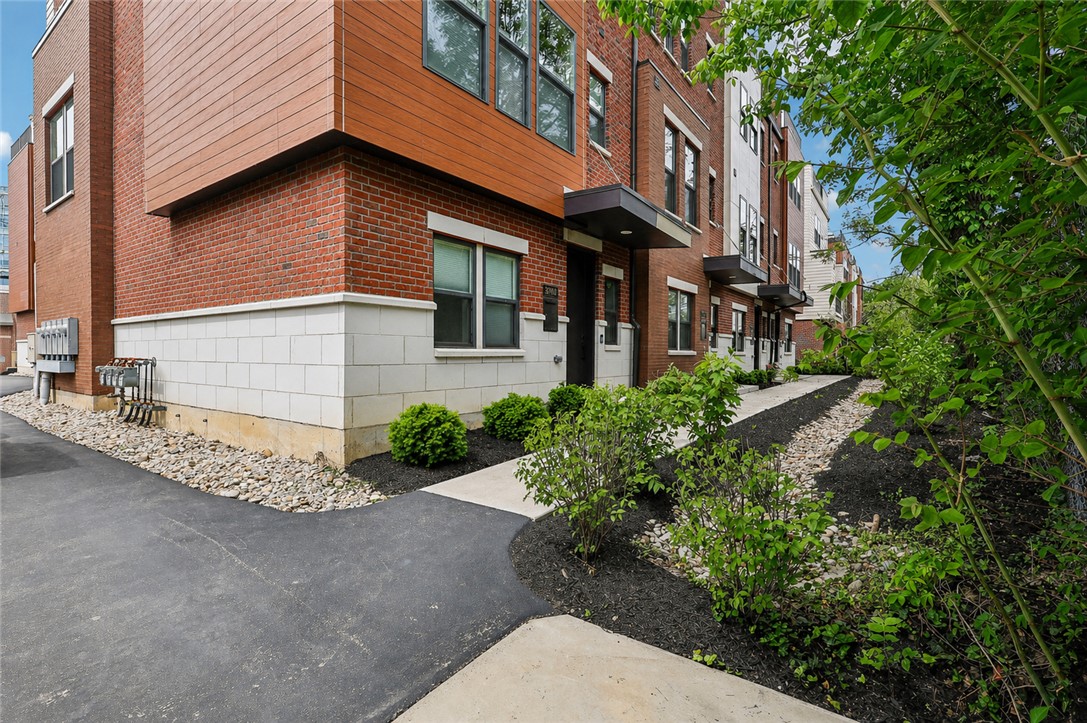 3906 Edwards Road, Unit C Cincinnati, OH 45209 - Photo 44 of 46 These modern townhomes showcase a blend of brick and contemporary siding, offering a dynamic curb appeal.