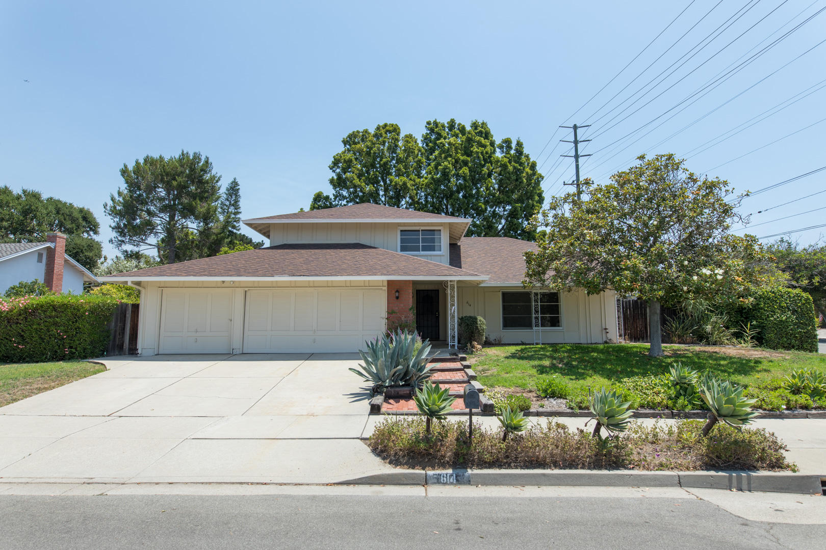 614 Arundel Road Goleta, CA 93117 - Photo 1 of 18 a front view of a house with a garden