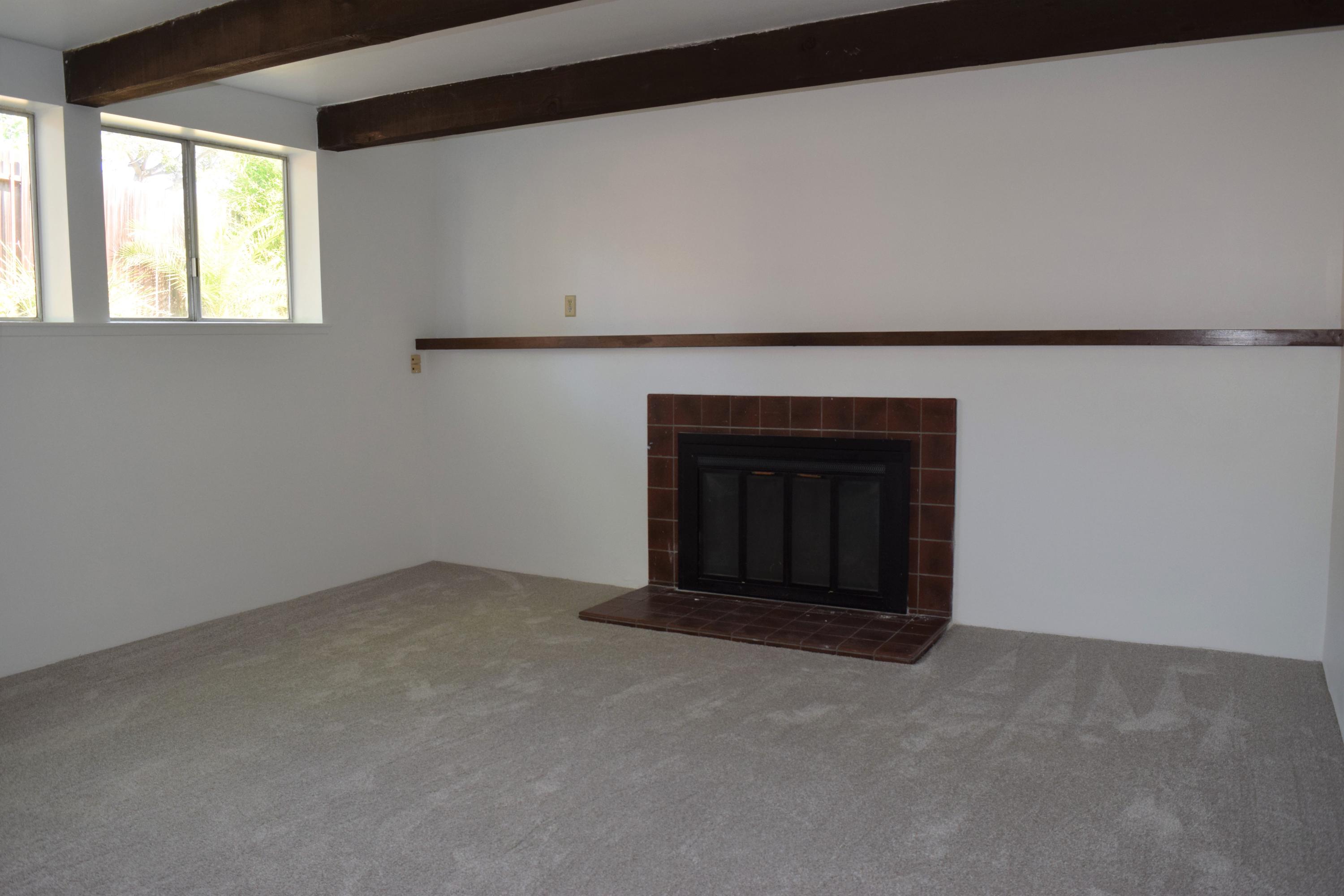 614 Arundel Road Goleta, CA 93117 - Photo 5 of 18 a living room with a fireplace