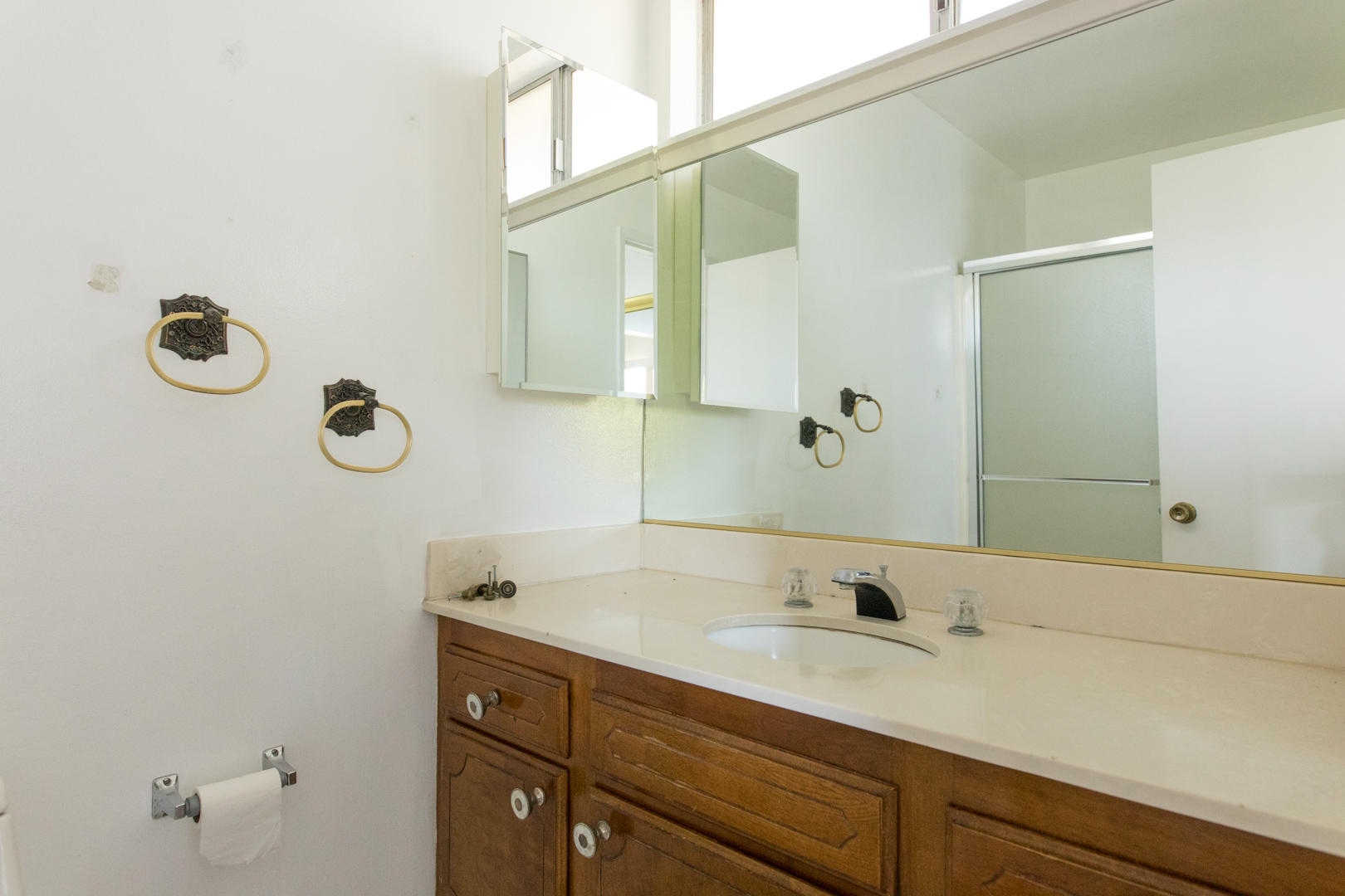 614 Arundel Road Goleta, CA 93117 - Photo 10 of 18 a bathroom with a sink and a mirror