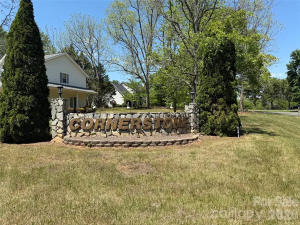 a view of a house with a yard covered with snow in front of house