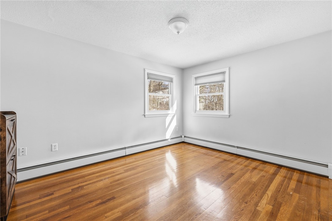 15 Anita Road Johnston, RI 02919 - Photo 14 of 28 Hardwoods continue into the second bedroom.