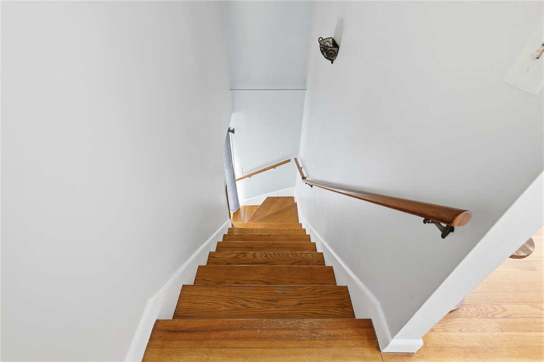 15 Anita Road Johnston, RI 02919 - Photo 18 of 28 Hardwood treads lead you to a finished, bonus area.
