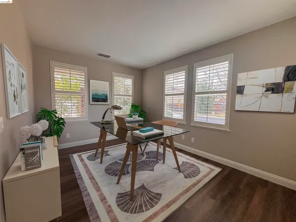 a workspace with furniture and a window