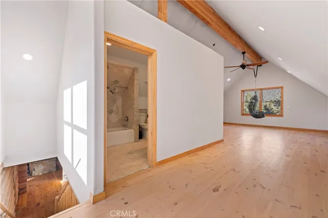 a spacious bathroom with a tub and shower