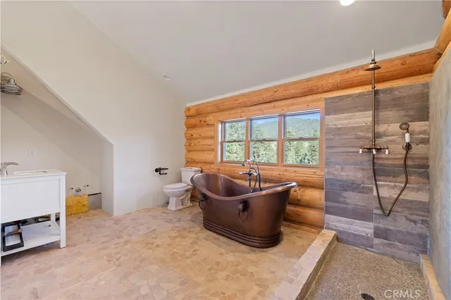 a view of balcony with wooden floor and outdoor seating