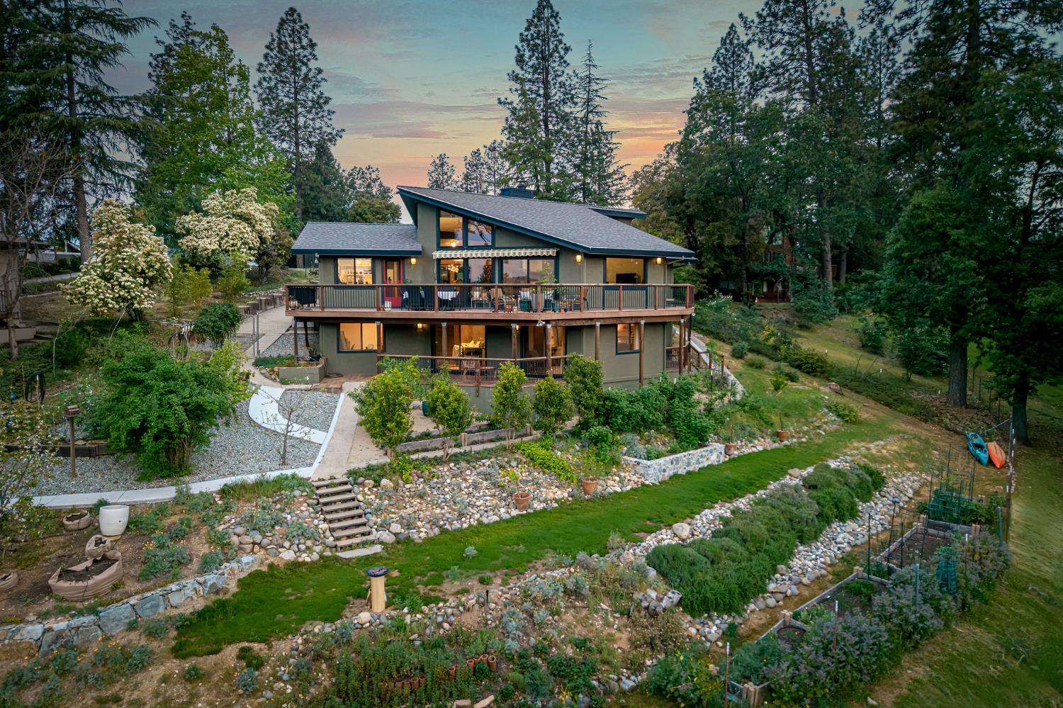 16105 John Way Grass Valley, CA 95949 - Photo 2 of 71 a front view of a house with a yard