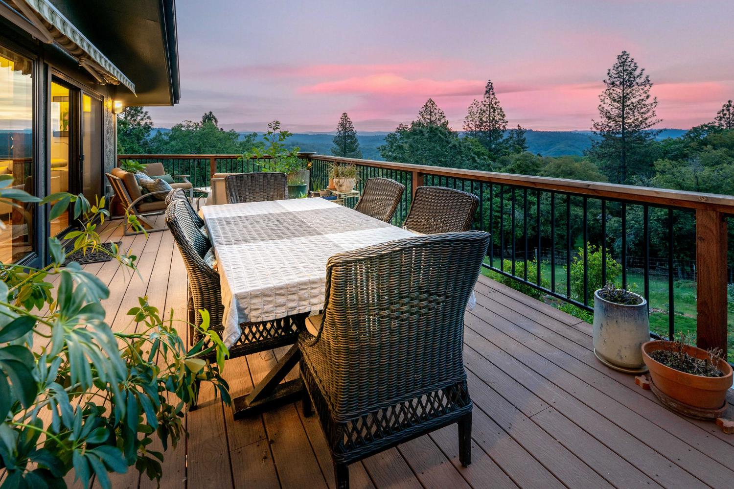 16105 John Way Grass Valley, CA 95949 - Photo 3 of 71 a view of a balcony with wooden floor and outdoor seating