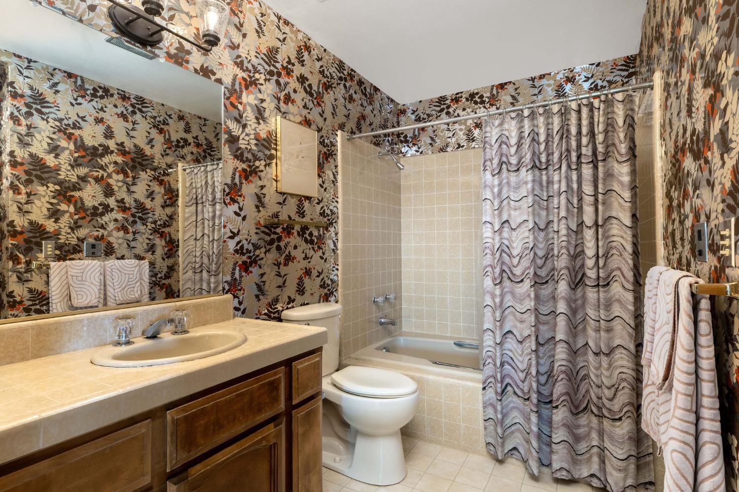 16105 John Way Grass Valley, CA 95949 - Photo 41 of 71 a bathroom with a sink toilet and shower