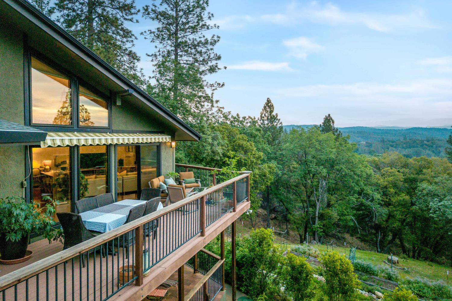 16105 John Way Grass Valley, CA 95949 - Photo 51 of 71 a view of house with trees in front of it